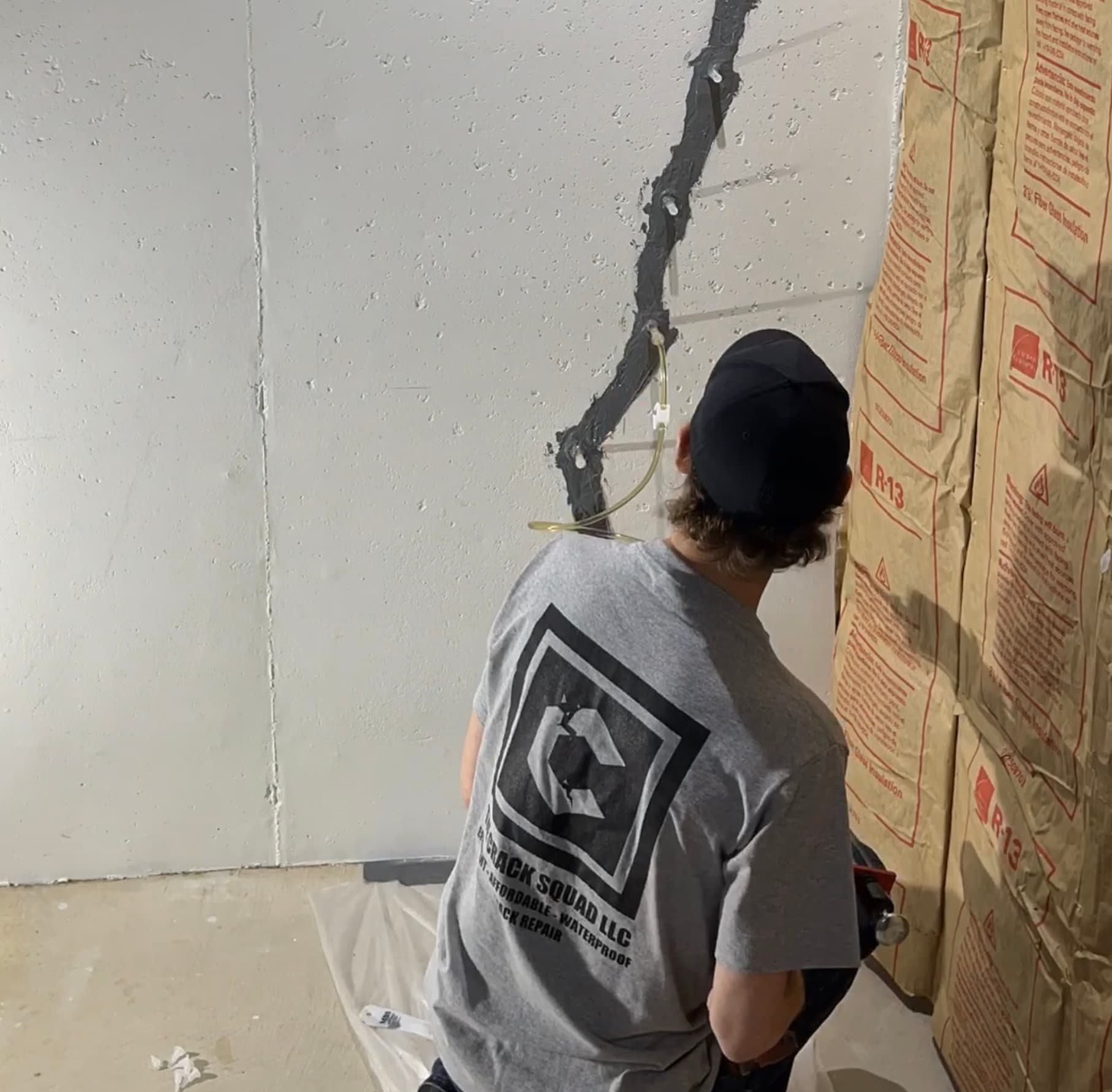 Technician inspecting wall crack